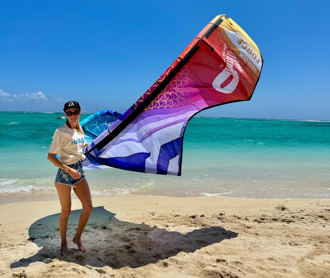 Student launching a kite in the Le Morne lagoon